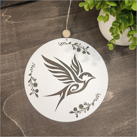 Hanging acrylic circle wall art featuring a white Welcome Swallow, symbolizing warmth and Kiwiana charm.