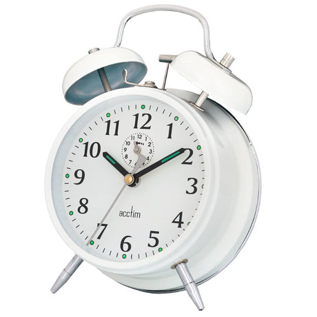 Classic white double bell alarm clock with wind-up mechanism and luminous hands, perfect for vintage decor.