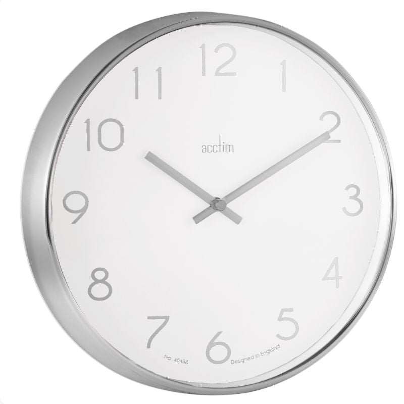 Sleek 25cm chrome wall clock with white face, debossed foil numerals, and quartz movement for stylish timekeeping.