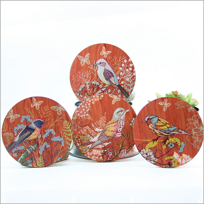 Set of 4 bird-illustrated coasters, featuring cork base and MDF construction, perfect for protecting surfaces and enhancing decor.