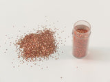 Vibrant apricot edible glitter for baking and crafting, perfect for cakes and desserts at festive gatherings.