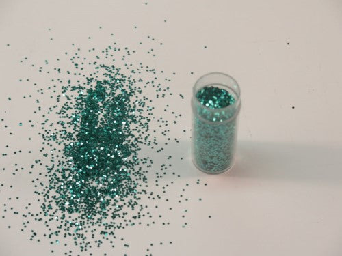 Aqua glitter from Das, 1/24" size, ideal for scrapbooking and crafts, adds vibrant shimmer to artistic projects.