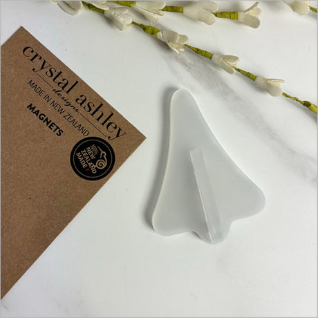 White satin acrylic jet plane magnet inspired by Kiwi lollies, perfect for decor and organization.