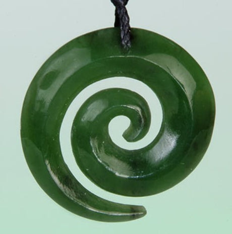 Jade Open Koru Pendant on an adjustable cord, symbolizing growth and renewal, uniquely carved from Nephrite Jade.