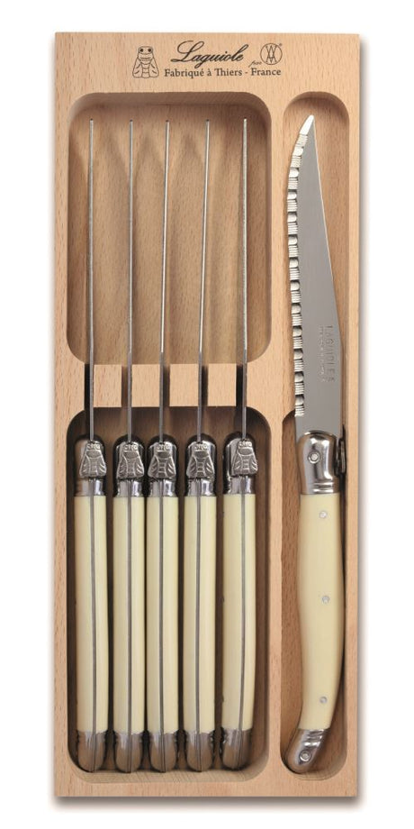 Set of 6 ivory-handled steak knives by Andre Verdier, featuring stainless steel blades and the iconic Laguiole Bee.
