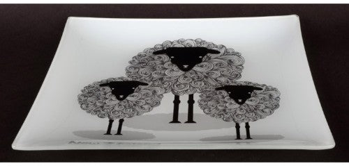 Ornamental glass plate featuring a cute sheep design, celebrating New Zealand's sheep culture, ideal for decor or gifting.