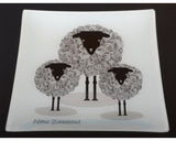 Ornamental glass plate featuring an adorable sheep design, perfect for home decor or as a unique Kiwiana gift.