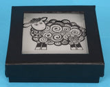 Set of four tempered glass coasters featuring unique New Zealand Koru sheep designs, ideal for home decor and gifting.