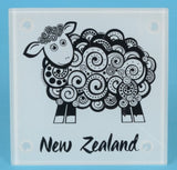 Set of four tempered glass coasters featuring unique Koru sheep designs, ideal for home decor and gift giving.