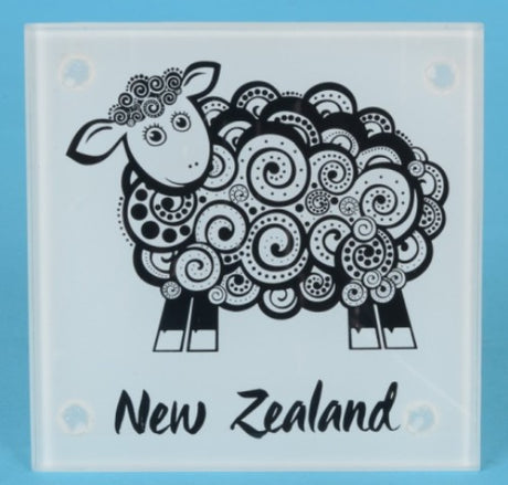 Set of four tempered glass coasters featuring unique Koru sheep designs, ideal for home decor and gift giving.