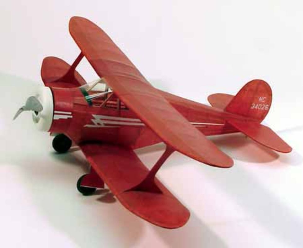 17 1/2-inch Balsa Glider Staggerwing model with vibrant decals, laser-cut parts, and a robust plastic propeller for stable flights.