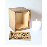 Eco-friendly bamboo tealight box featuring laser-cut designs and color-changing LED candle for ambient lighting.