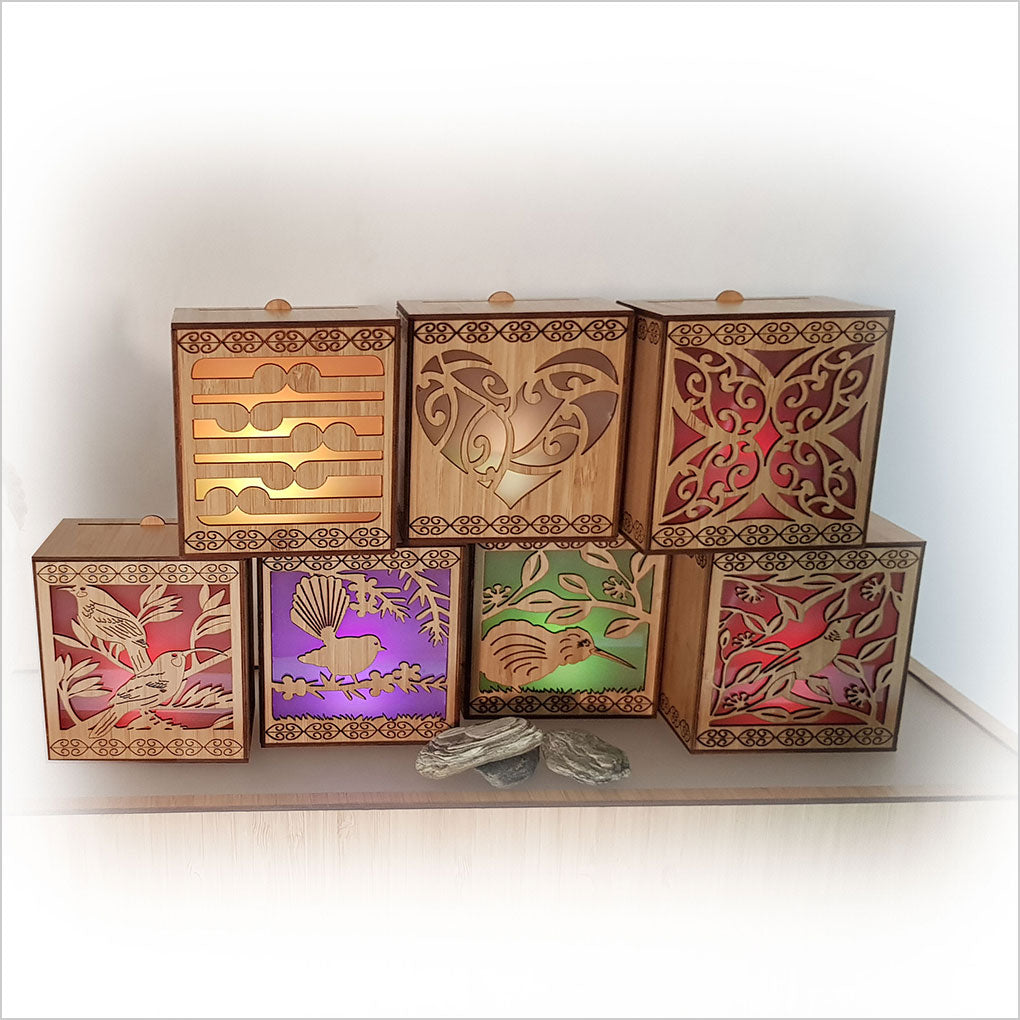 Koru LED Tealight Candle Box in bamboo veneer, featuring color-changing tealight and wall-mounting option for ambiance.