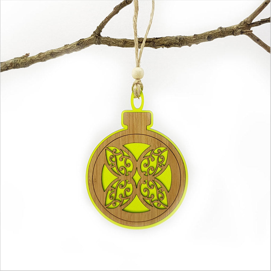 Lime green acrylic bauble ornament featuring a laser-cut flower, perfect for festive decor and easy to hang.
