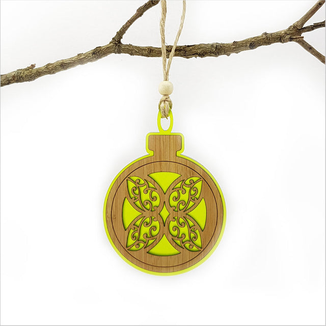 Lime green acrylic bauble ornament featuring a laser-cut flower, perfect for festive decor and easy to hang.