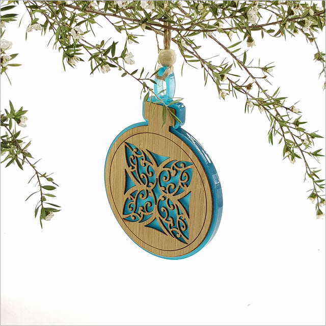 Teal satin acrylic bauble ornament with Kww flower design, perfect for holiday decor or gifting, measuring 80mm x 110mm.