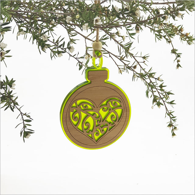 Lime green heart-shaped acrylic bauble ornament, elegantly hanging, perfect for festive decor and gifts.