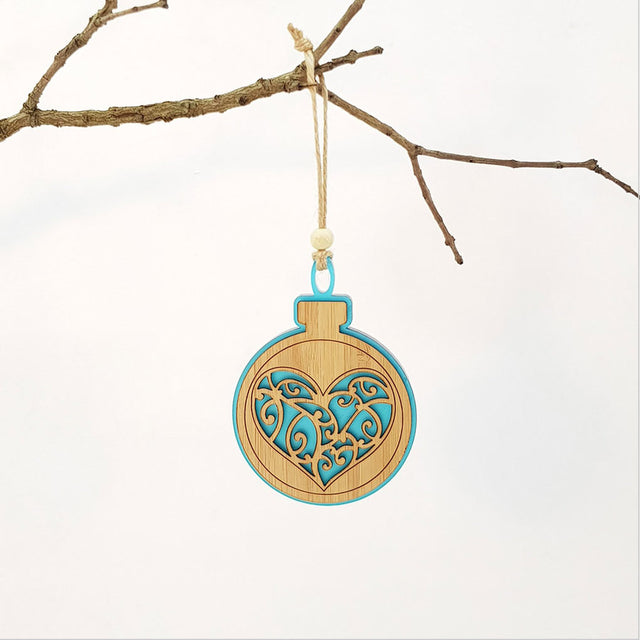 Teal satin acrylic heart-shaped hanging ornament with bamboo detailing, perfect for holiday decor and gifting.