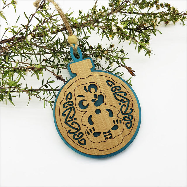 Teal bamboo and satin acrylic hanging ornament, Tiki design, perfect for festive decor and unique gifting.