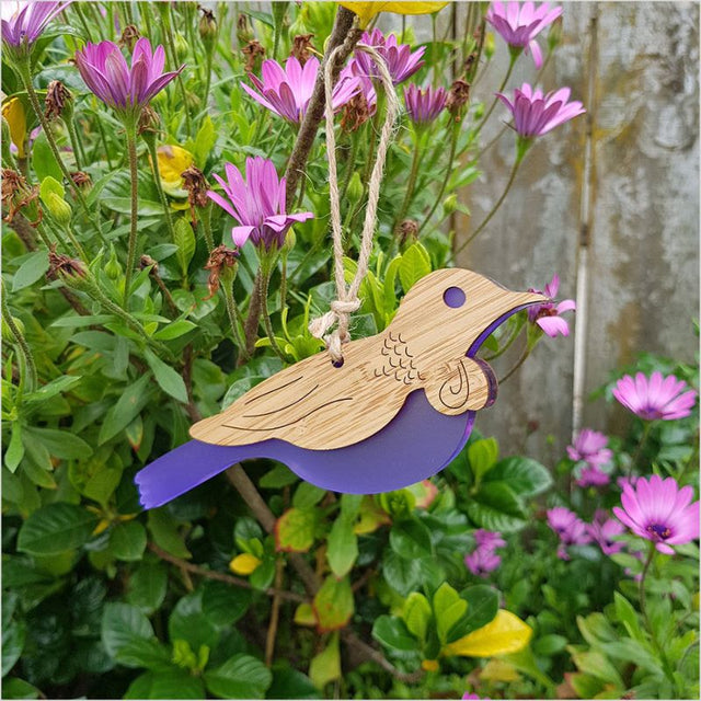 Hanging Tui ornament crafted from bamboo with purple satin acrylic, perfect for home decor and easy to hang.