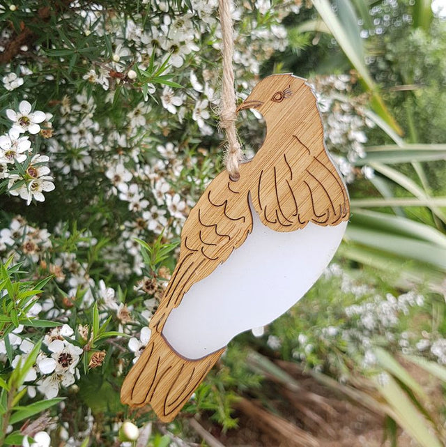 Elegant Hanging Ornament featuring a Kereru design, made from laser-cut bamboo and white satin acrylic, 96mm x 118mm.