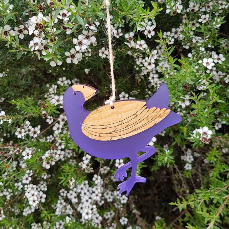 Whimsical Pukeko hanging ornament in eco-friendly bamboo and vibrant purple satin acrylic, perfect for home decor.