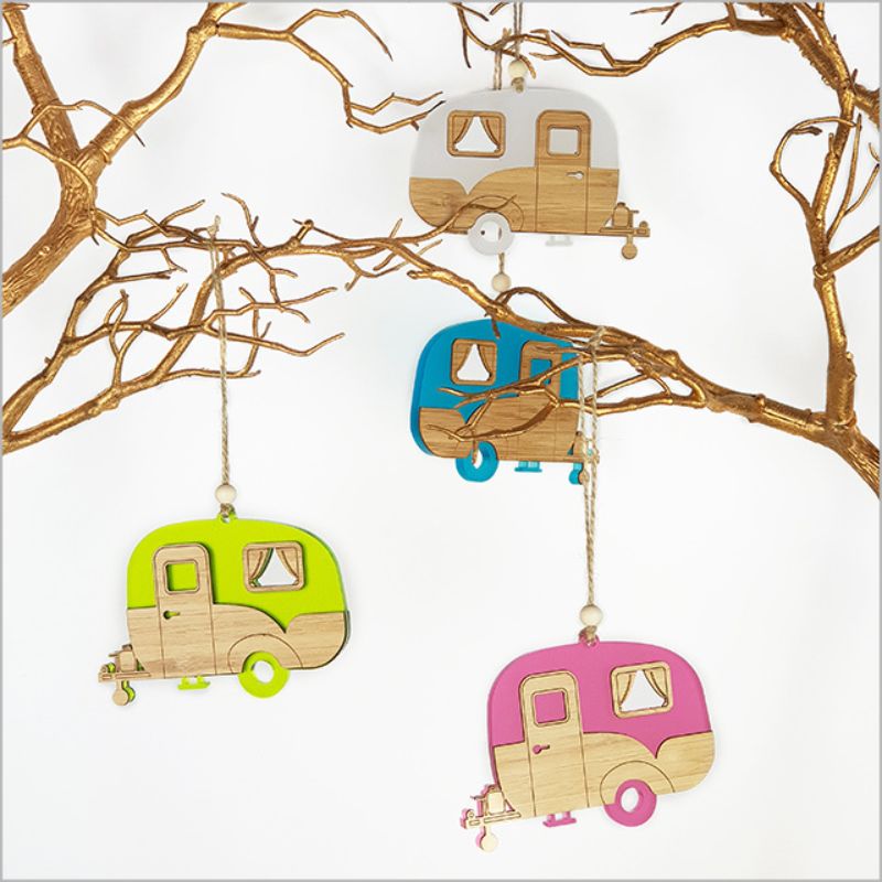 Pink satin acrylic hanging ornament shaped like a caravan, featuring a laser-cut bamboo base, perfect for holiday decor.