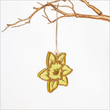 Hanging Daffodil Flower ornament made of bamboo and yellow satin acrylic, perfect for eco-friendly home decor.
