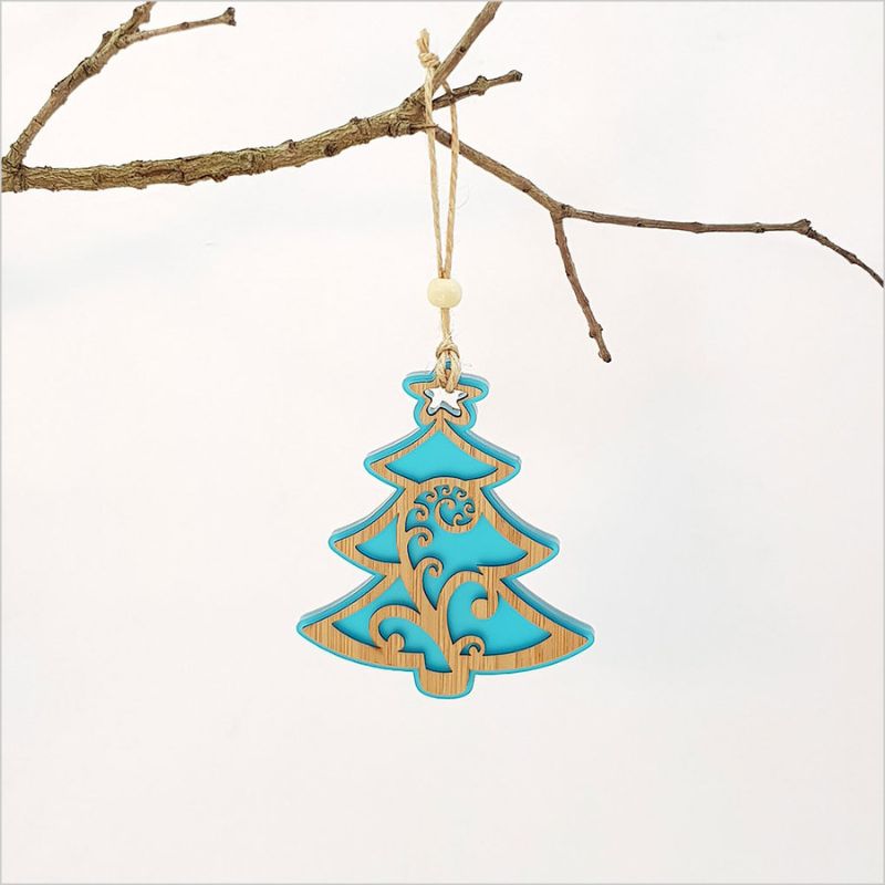 Teal Ice Acrylic Koru Xmas Tree ornament with laser-cut design, perfect for holiday decor and gift-giving.