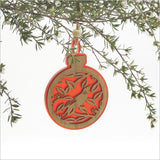 Red acrylic bauble featuring a laser-cut Tui on a Pohutukawa branch, perfect for festive decorations.