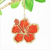 Red satin acrylic hibiscus ornament with intricate laser-cut design, perfect for festive decorating or gifting.