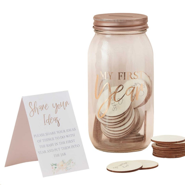 Glass memory jar with 50 tokens for celebrating baby's first-year milestones and precious moments.