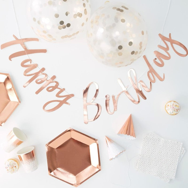 Rose Gold Foiled Party In A Box featuring elegant decor essentials for stylish celebrations: plates, cups, napkins, hats, balloons, and bunting.