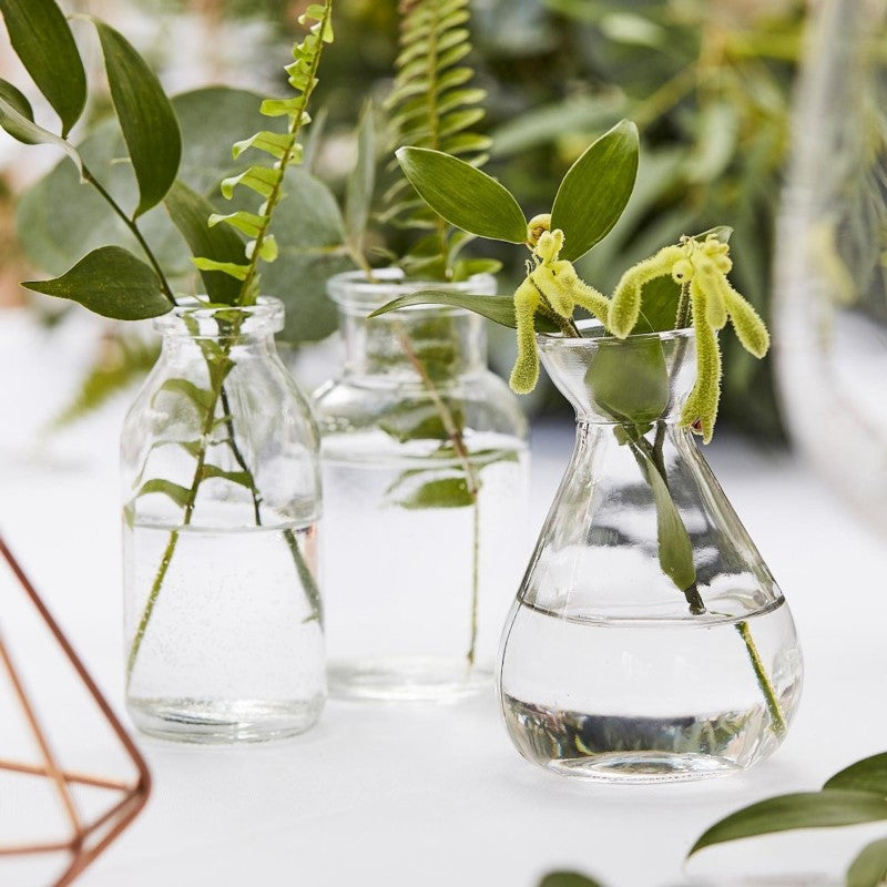 Set of 3 glass wedding vases, 10cm high, perfect for simple botanical decorations.