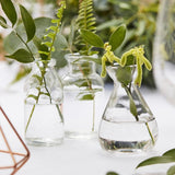 Set of 3 glass wedding vases, 10cm high, perfect for simple botanical decorations.