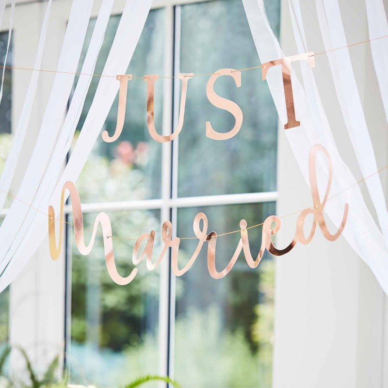 Rose gold 'Just Married' bunting with botanical design, perfect for wedding decor, featuring 2 strands of 1.5m each.