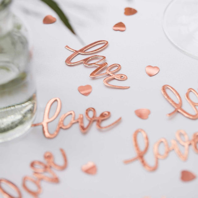 Botanical Wedding Confetti Bronze 'Love' Cards in rose gold, perfect for table decor at weddings, measuring 3.5cm by 6.5cm.
