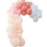 Pastel balloon arch kit with 75 latex balloons in peach, pink, and blue for vibrant celebration backdrops.