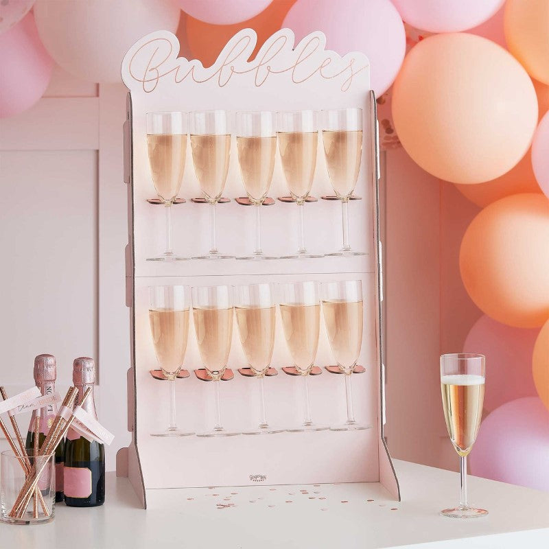 Elegant rose gold foiled prosecco wall for Bachelorette parties, featuring space for 10 bottles and chic design.