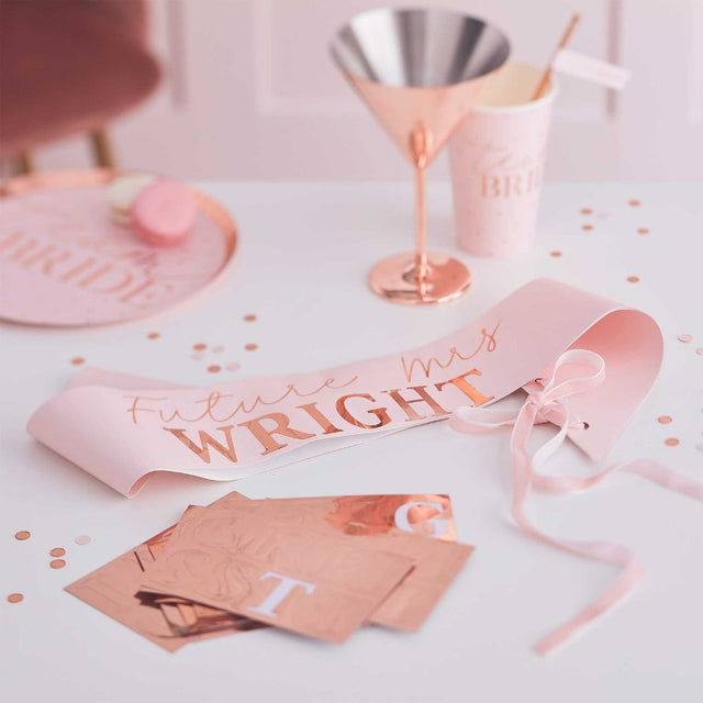 Personalised rose gold hen party sash with velvet ribbon, customizable with stickers, perfect for a bride-to-be's bachelorette celebration.