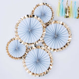 Elegant blue paper fan decorations with gold foiled scalloped edges, perfect for any celebration backdrop.