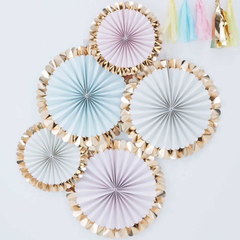 Pastel paper fan decorations with gold foiled edges, perfect for creating elegant backdrops at celebrations.