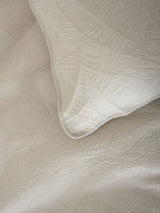 Elegant oatmeal coverlet set for King/Super King beds with charming leaf texture and soothing sand hue.