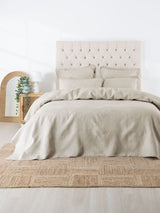 Elegant Oatmeal Manon Coverlet Set by Savona for King/Super King beds, featuring leaf-textured quilted design and 100% cotton.