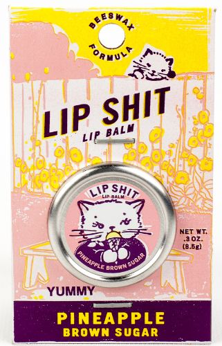 Adorable kitty on lip balm tin, flavored with pineapple and brown sugar, provides intense moisture for hydrated lips.