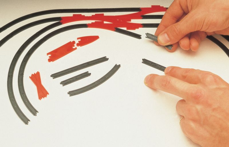 Hornby Track Planning Symbols kit with over 100 quarter-scale track replicas for designing model train layouts.