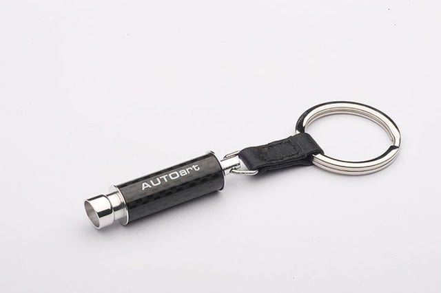 AUTOart diecast keychain featuring a carbon fibre exhaust design, perfect for car enthusiasts and everyday use.