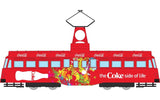 1/76 diecast Coca-Cola tram model featuring vibrant 'Coke Side of Life' branding for collectors and enthusiasts.