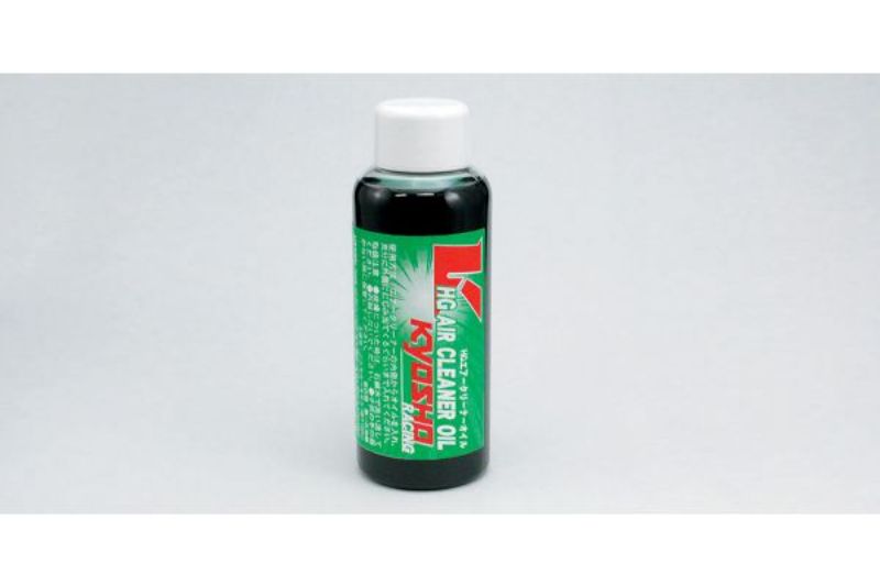 Green air cleaner oil for RC cars, 100cc, enhances performance and traps dirt efficiently.