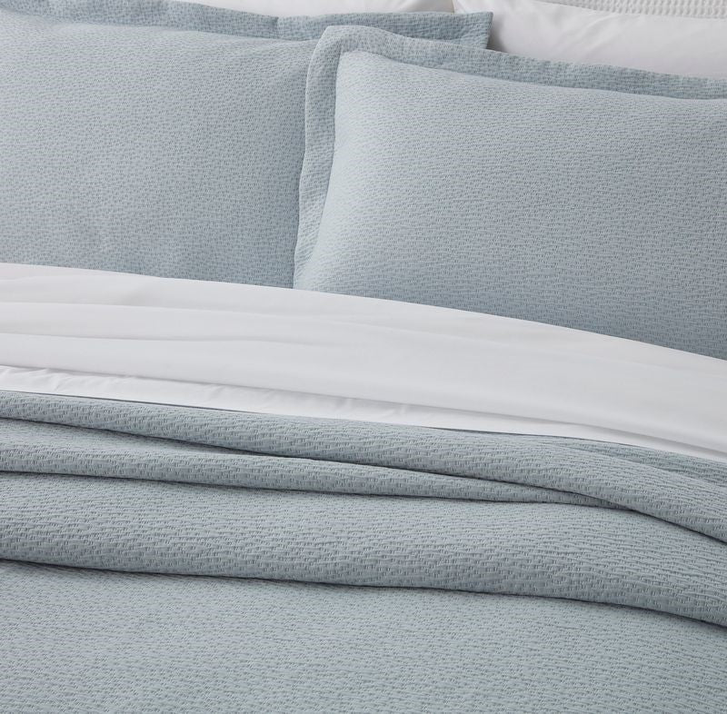 Elegant PORTO Duck Egg Bedspread Set by BAKSANA, featuring 100% cotton, mitred corners, and two Oxford pillowcases.